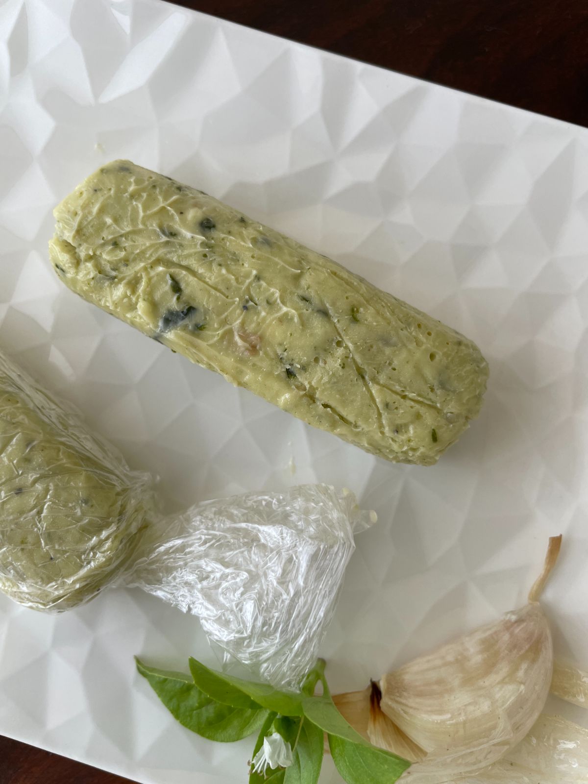 pesto butter rolled in a log