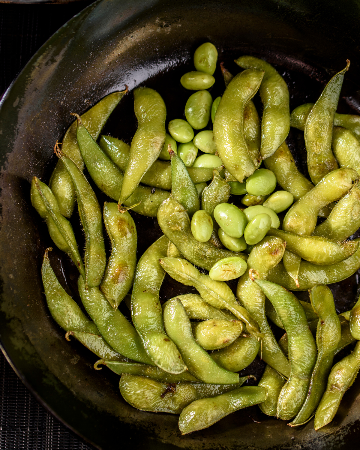 fried edamame in a pan