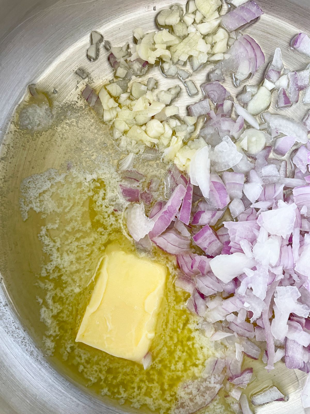 saute chopped onions and garlic in butter 