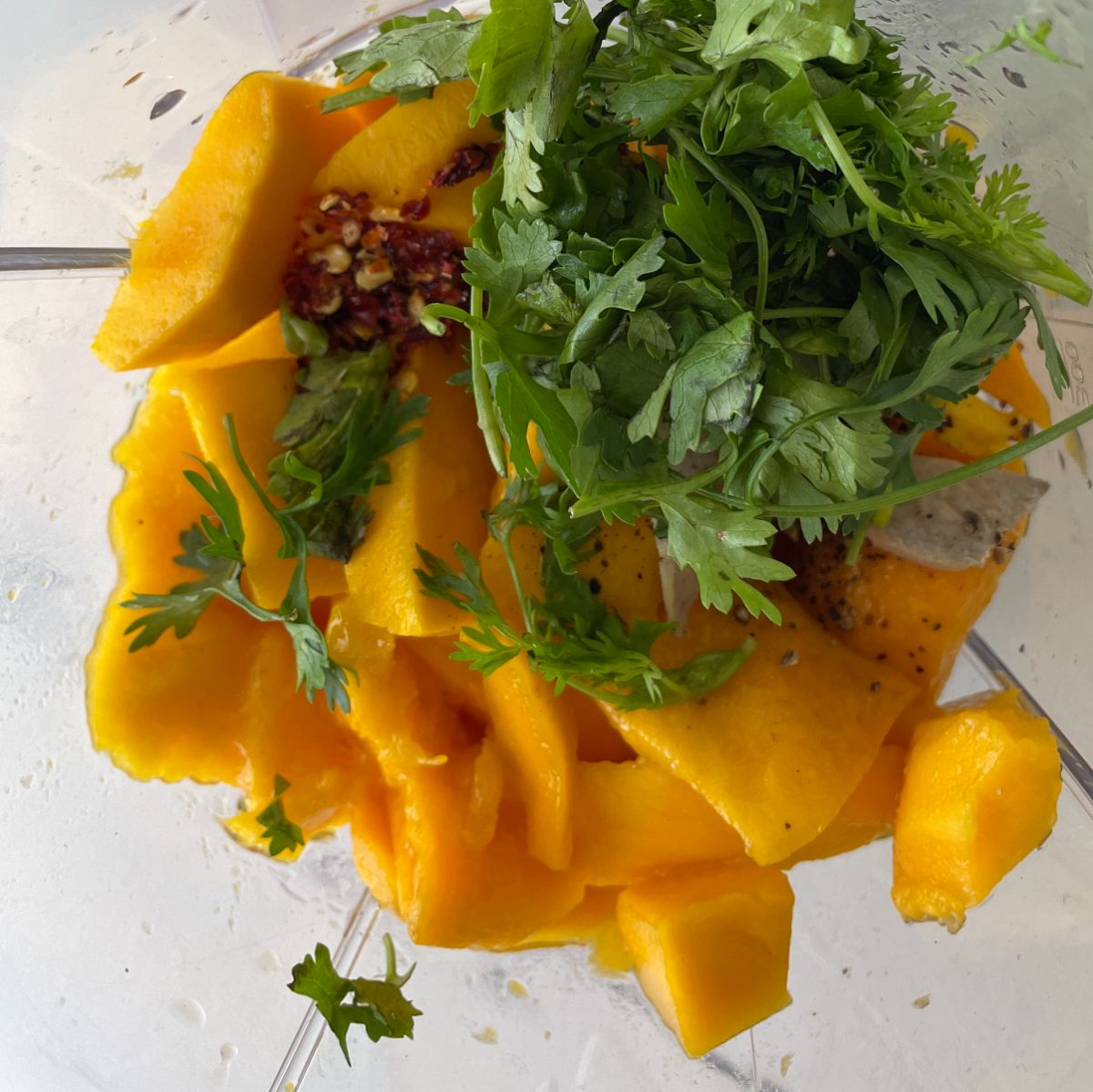 combine mango pieces and other ingredients into the bowl 