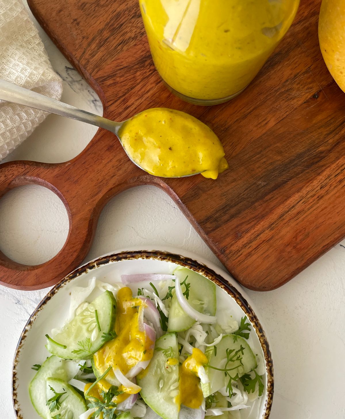 Creamy Mango Salad Dressing in a spoon 