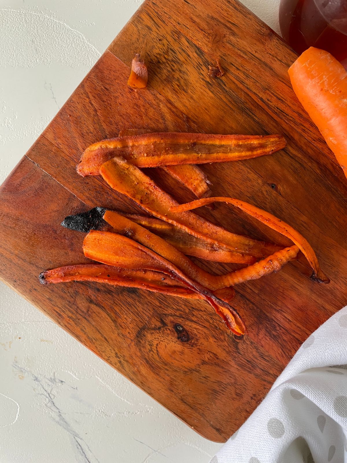 delicious carrot bacon on a wooden chopping board