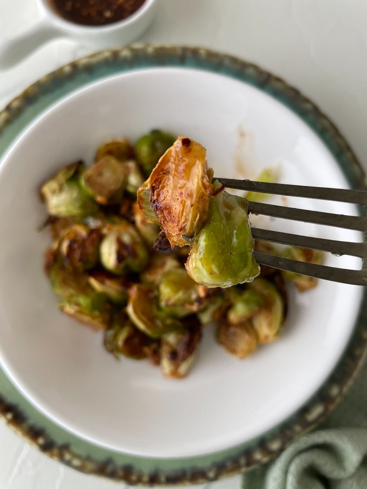 honey sriracha Brussels sprouts in a fork