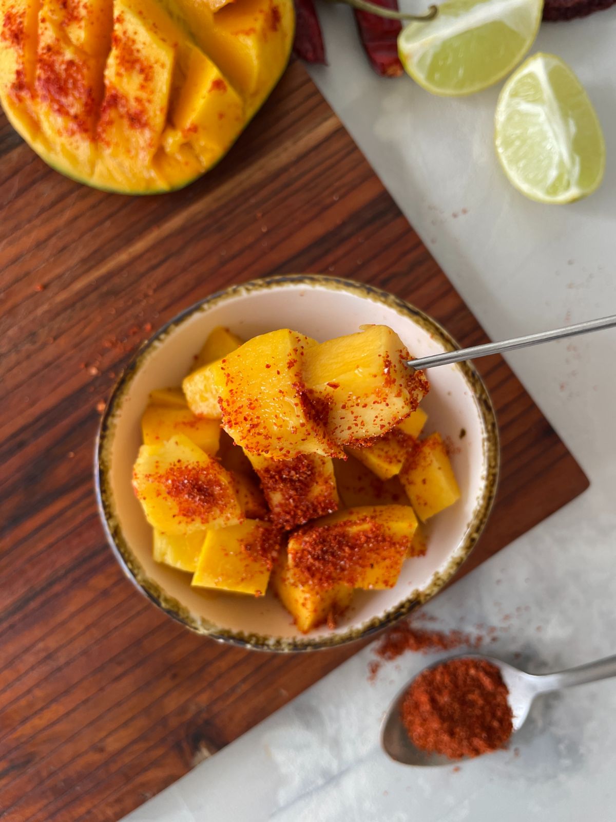 mango con tajin in a bowl