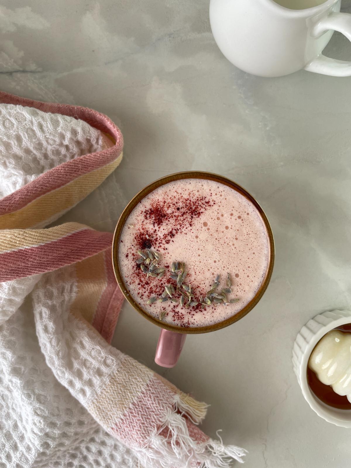 pink beet latte served in a cup