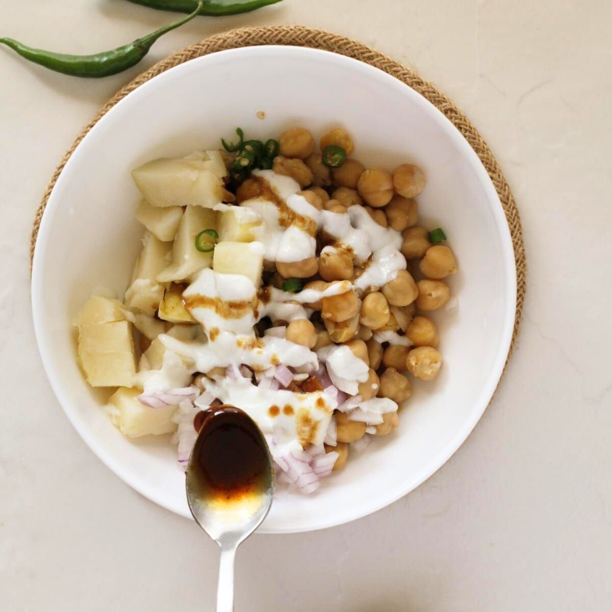 drizzle some yogurt mixture and chutney over the chickpea mixture