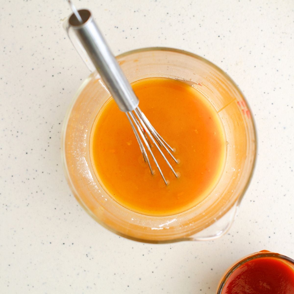 Combine hot sauce with orange juice 