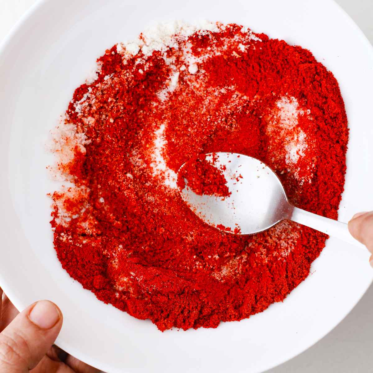 mixing the spices for the homemade tajin seasoning