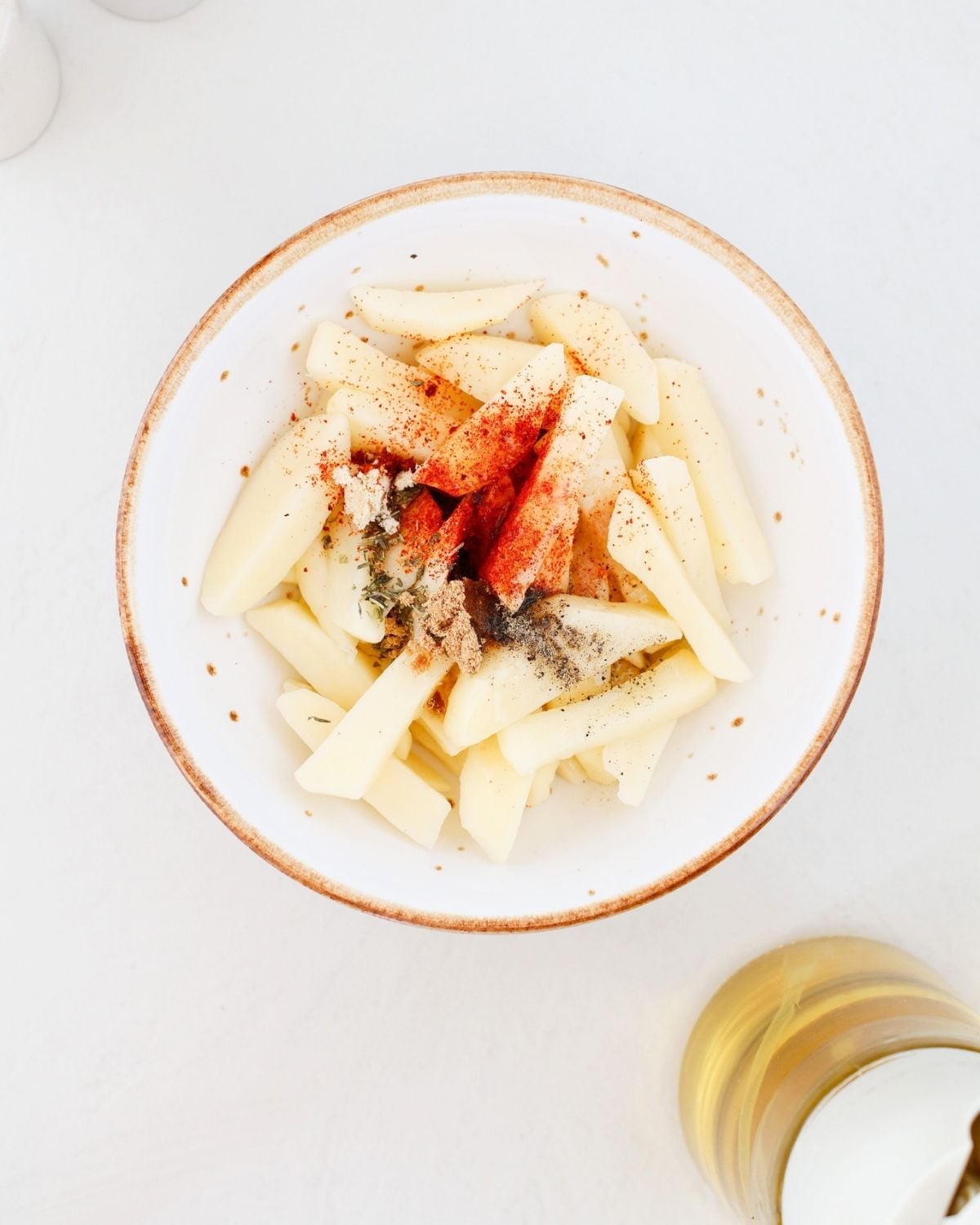 Potato fries tossed with oil and spices