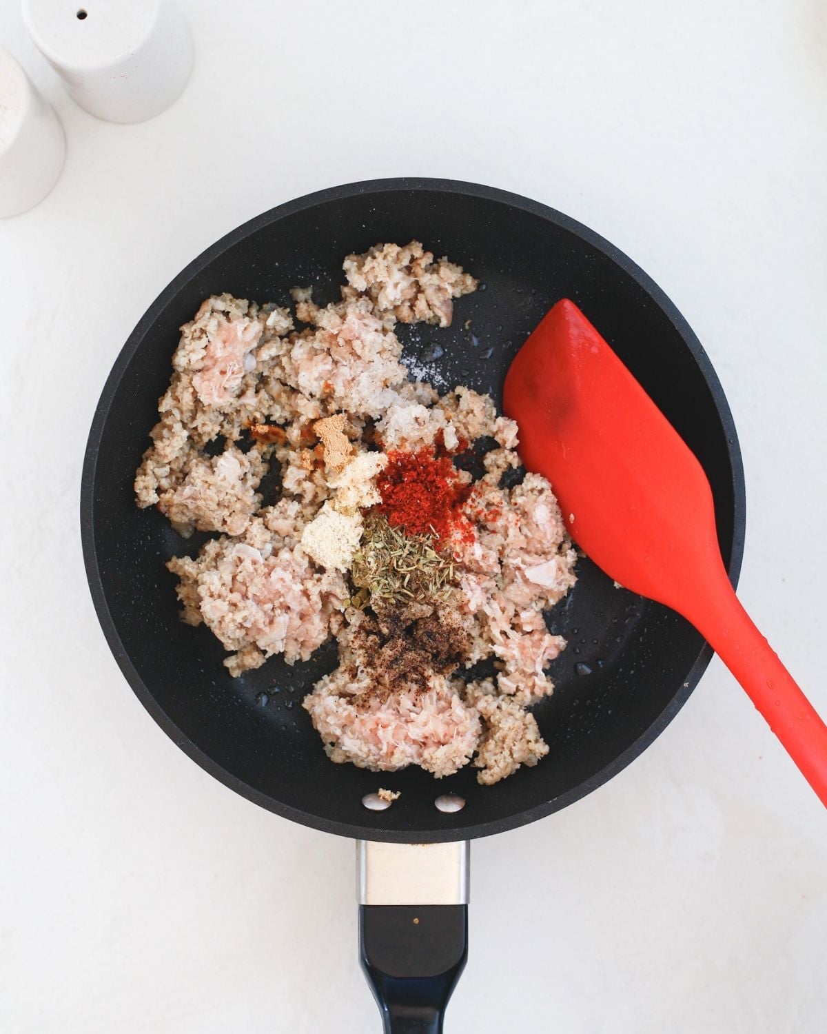 Ground beef with spices in a skillet